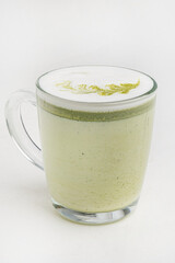 matcha latte in white cup on the white