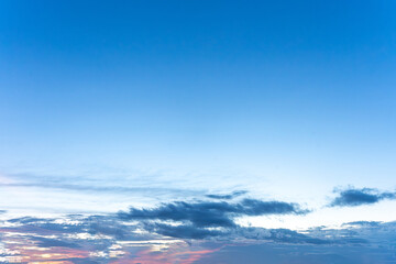 Bright summer sky with clouds over mountains and a clear, beautiful landscap