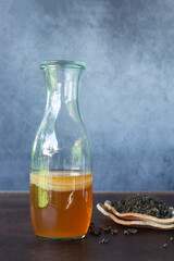 jars of kombucha and scoby healthy probiotic drink with oolong loose leave tea.
