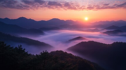 Obraz premium Sunrise Over Misty Mountains