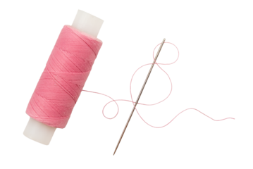 Old spool of thread and needle on a white background. Sewing accessories