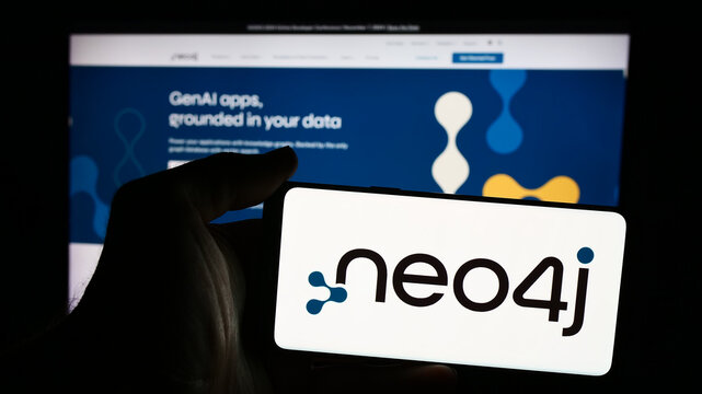 Stuttgart, Germany - 08-19-2024: Person holding mobile phone with logo of American analytics software company Neo4j Inc.  in front of business web page. Focus on phone display.