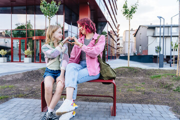 Love and bonding family concept. Mother and teenage daughter enjoy time together outdoors