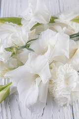 Beautiful bouquet of white carnations and gladiol