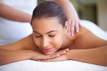 Obraz premium Relax, woman and back massage with therapist at spa for peace, wellness and stress relief at luxury resort. Hands, masseuse and person in beauty therapy at salon for body treatment, detox and health
