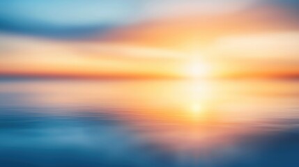 Obraz premium A beautiful sunset reflecting on calm water, creating a serene and peaceful atmosphere with vibrant colors and soft tones.