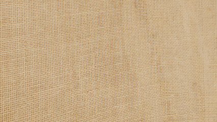 Brown linen fabric cloth texture for background, natural textile pattern.