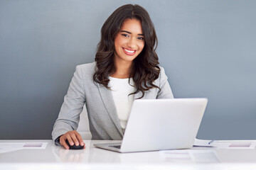 Portrait, accountant and woman with laptop, smile and finance clerk on gray studio background. Face, happy person and employee with pc, online system and revenue report with admin, joy and connection