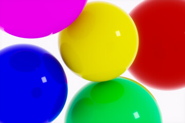 Bright colored shiny balls as an abstraction on a white background.