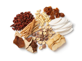 Group of Chinese dried herbs to make a healthy soup or bouillon isolated on white background