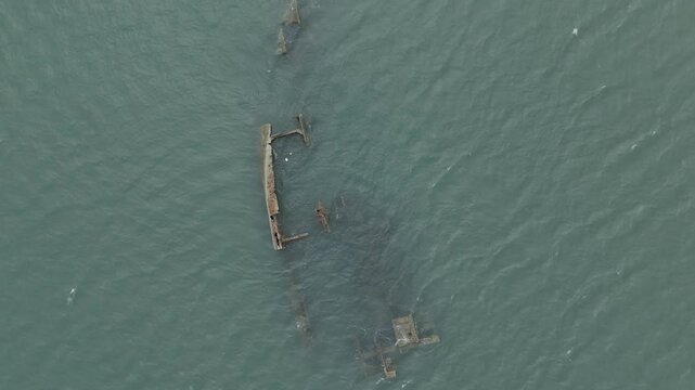 Drone flies camera down over Naufr&aacute;gio Navio Beny shipwreck near the coast in Fortaleza, Ceara, Brazil