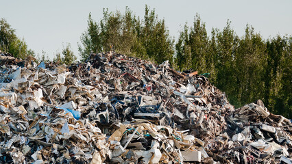 a mountain of metal waste at a metal recycling and collection point