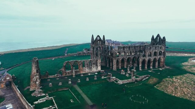 Foggy winters scene of the famous landmark Whitby Abby now derelict and formally a Benedictine abbey and is situated overlooking the sea on the East coast of England