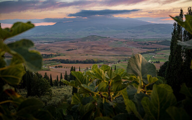 Sunset over rolling hills in Tuscany