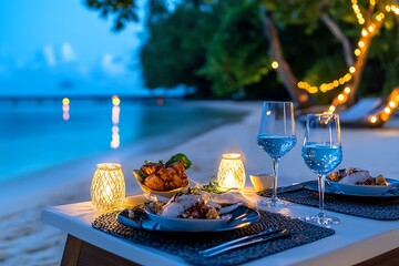 A romantic beach dinner setup with candles, wine glasses, and tropical cuisine under a starry sky.