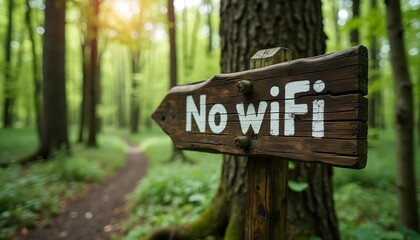 Rustic Wooden Sign in Lush Forest - 'No WiFi' Symbolizing Digital Detox in Nature