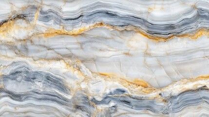 A close-up look at beautifully layered stone with gray and golden hues showcasing natural patterns and textures