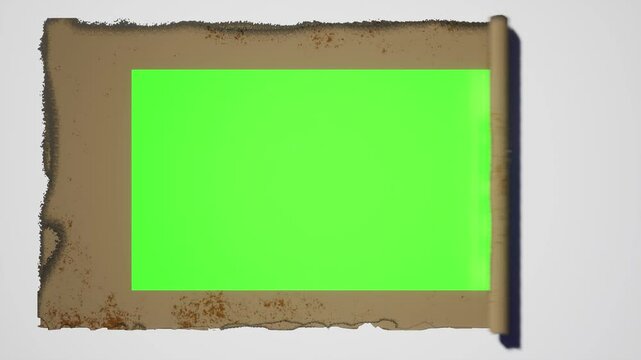 ancient scroll falls on a white background and then opens to reveal a green screen for a smooth video edit