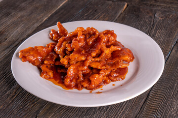 Sweet and Sour Chicken on wood table. Chinese food.