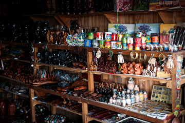 Explore a vibrant collection of handcrafted souvenirs from Madagascar displayed in a local market shop during the afternoon