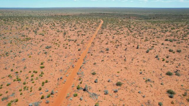 Remote track across the red Australian outback
