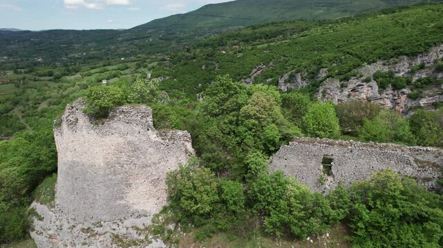 Old fortress Bocac ruins covered in forest from the 15th century