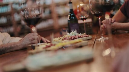 Couple of friends chatting at elegant business event. Wine. Cheese board. Restaurant. Argentina. 4k.