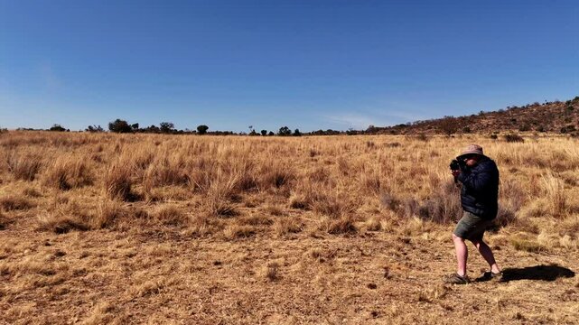 South African Farmer practices shooting skills outdoors, preparing for unplanned encounters with attackers on his farm for hsis own selfdefense