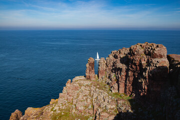 Lonely sailboat on the sea next to Cap Frehel.