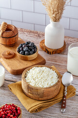 cottage cheese with berries in a bowl on the table