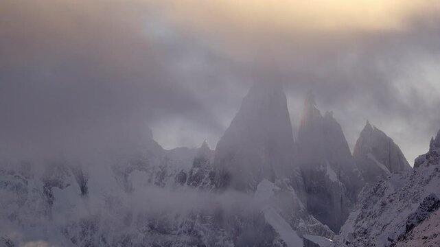 Timelapse of Cerro Torre massif with vertical granite walls and rime mushroom summits . Los Glaciares National Park, Patagonia.