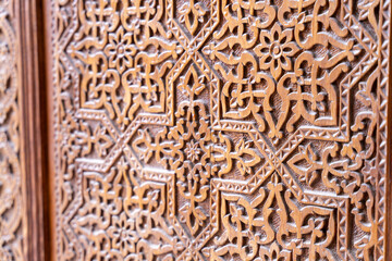 The wood carving has a lot of detail and is very intricate