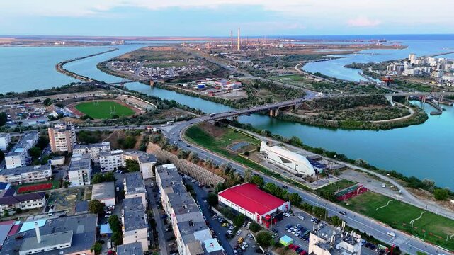 Aerial view of the northern branch of Danube-Black sea canal meeting the sea at Navodari