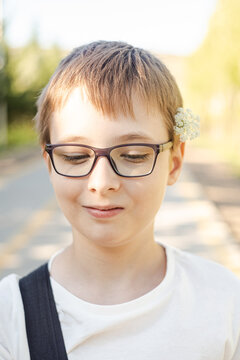 Nice boy with flowers in the hands