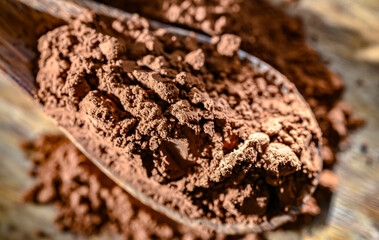 Wooden spoon of cocoa powder