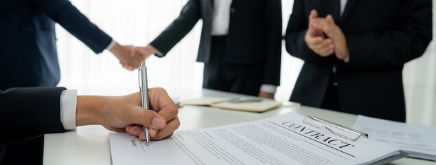 Two business executive shake hand in boardroom, sealing agreement merging two company. Handshake...