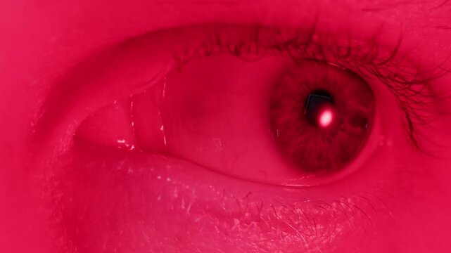 Detailed blue eye with strong gaze, showing human anatomy and beauty, thriller depression halloween style. Drugs concept.