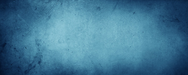 Blue textured concrete wall background. Dark edges