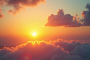 A serene image of the sunset over fluffy white clouds in the sky