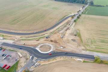 Aerial top view of roundabout under construction. development of new residential area. A roundabout...