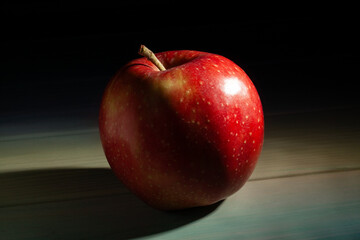 red apple on wood background