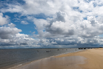 Walking on beach promenade in Arcachon, vacation destination town on Atlantic coast with beatiful parks, villas, streets and sandy beach, France