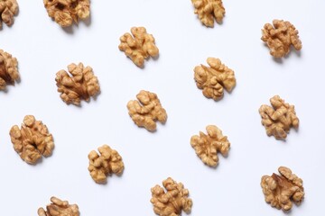 Walnuts on white background, top view