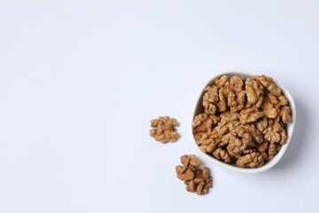 Walnuts on white background, top view