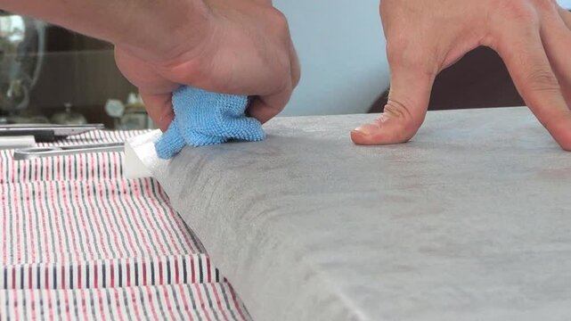 Close up view of renovating cabinet door coating.