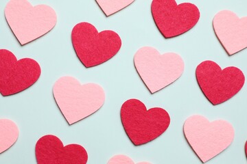 Hearts on color background, top view