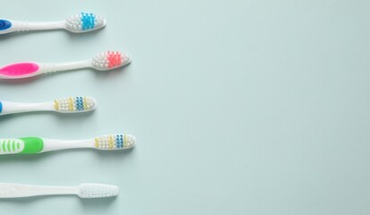 Various toothbrushes on a colored background. Concept of tooth treatment and dental care