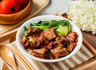 Mustard Beef Noodle Soup with Tender Braised Beef in bowl served in wooden tray side view of taiwan food