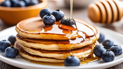 Professional photo of Close-up of pancakes gently drizzled with honey and garnished with blueberries. Aesthetic food backdrop