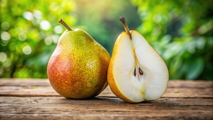 Fresh ripe pear sliced in half, revealing juicy white interior and brown pit, placed on a rustic wooden table with a natural outdoor background.